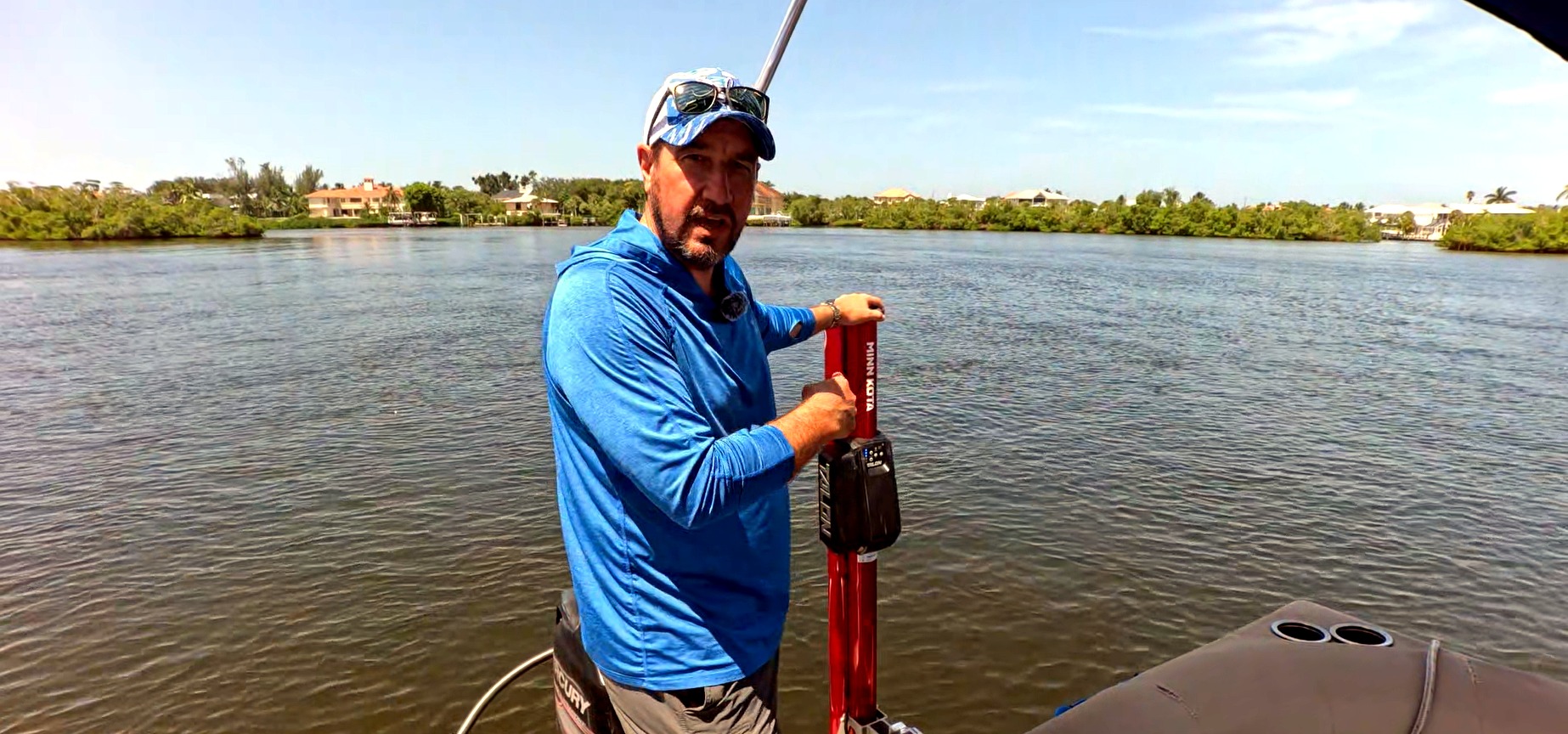 Minn Kota Talon 12 foot shallow water anchor mounted on a pontoon boat in Florida Gulf Coast water