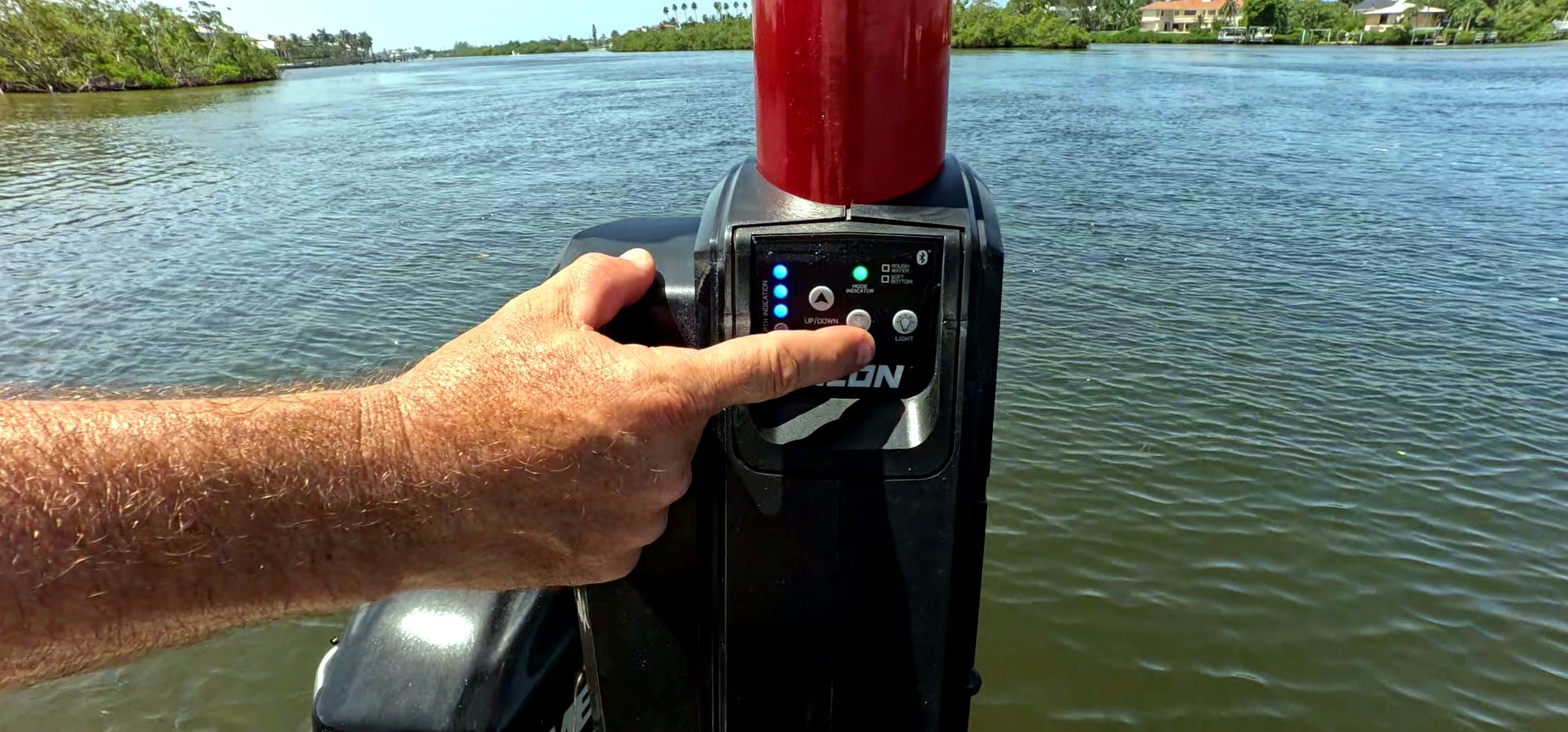 Minn Kota Talon control panel showing up and down buttons and rough water mode on a pontoon boat