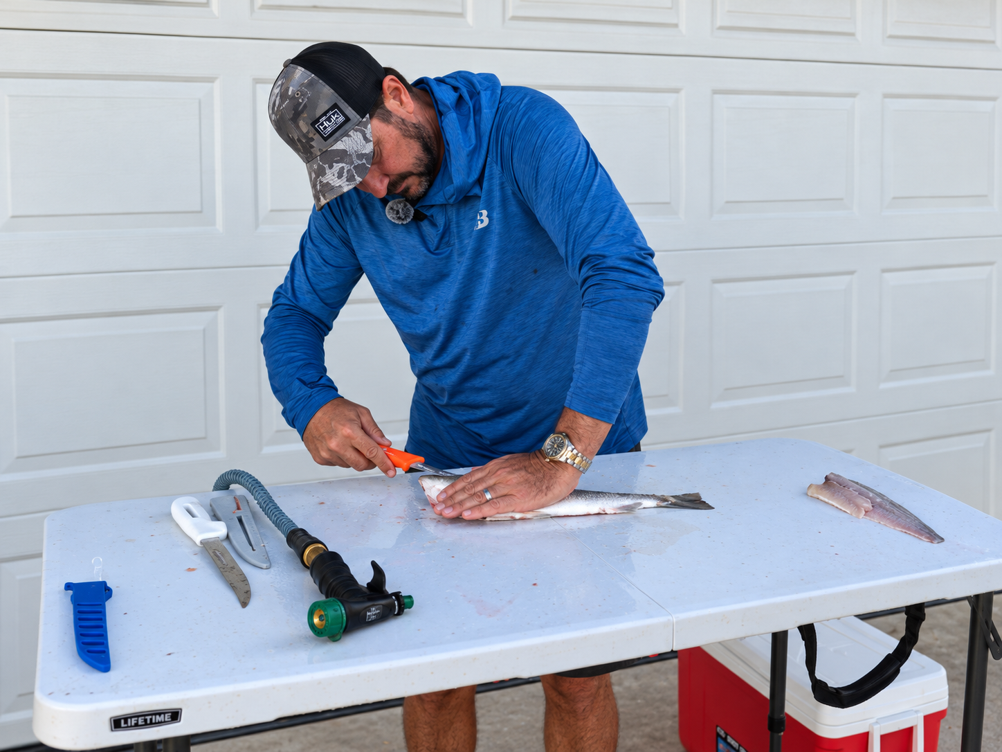 Jim using the Dexter Outdoors Dextreme 8 inch Max Flex fillet knife to clean a bonnethead shark
